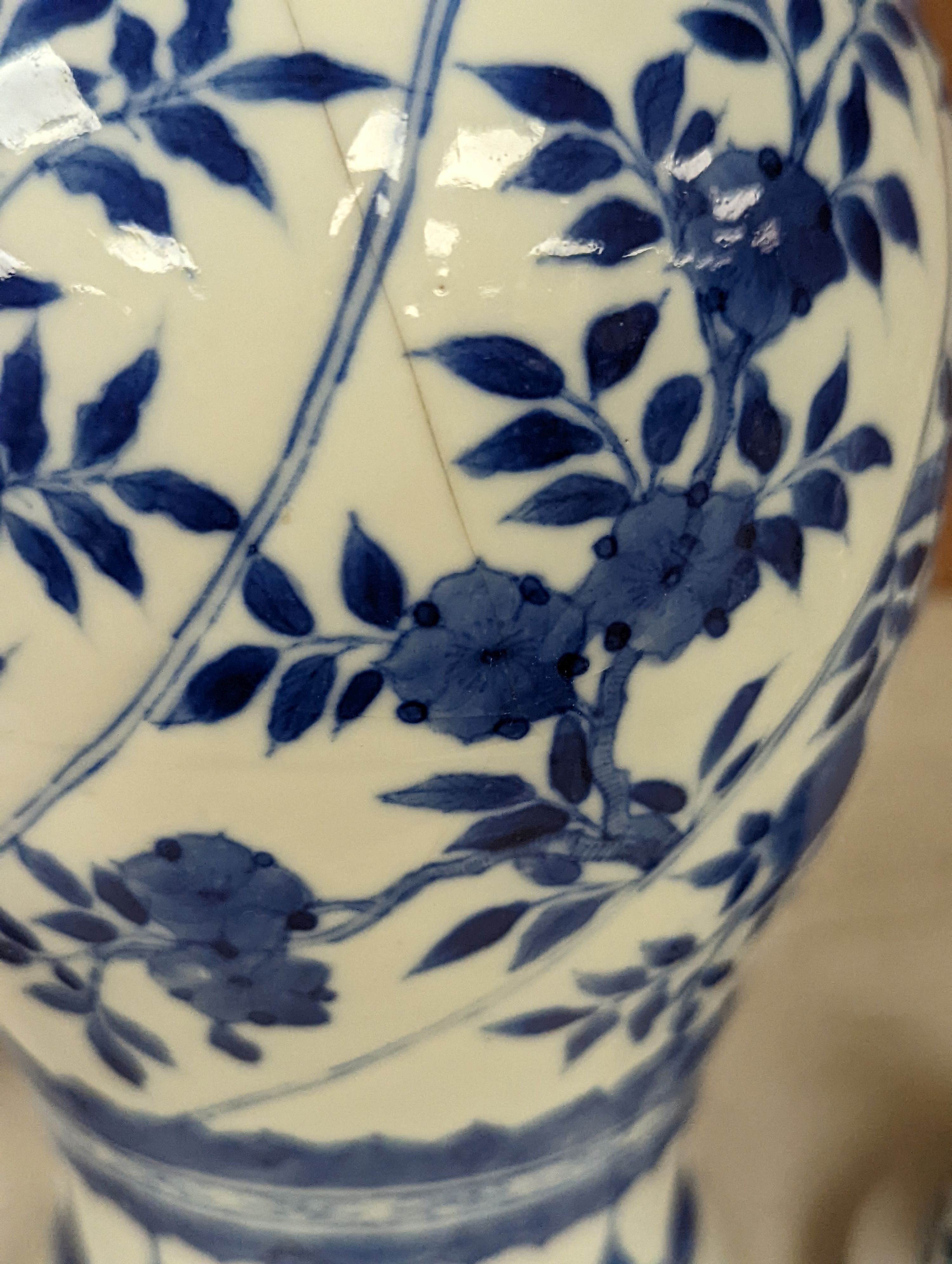 A Chinese blue and white vase and cover, Kangxi mark, 19th century, 26.5cm tall, and a Chinese Kangxi period small vase (2)